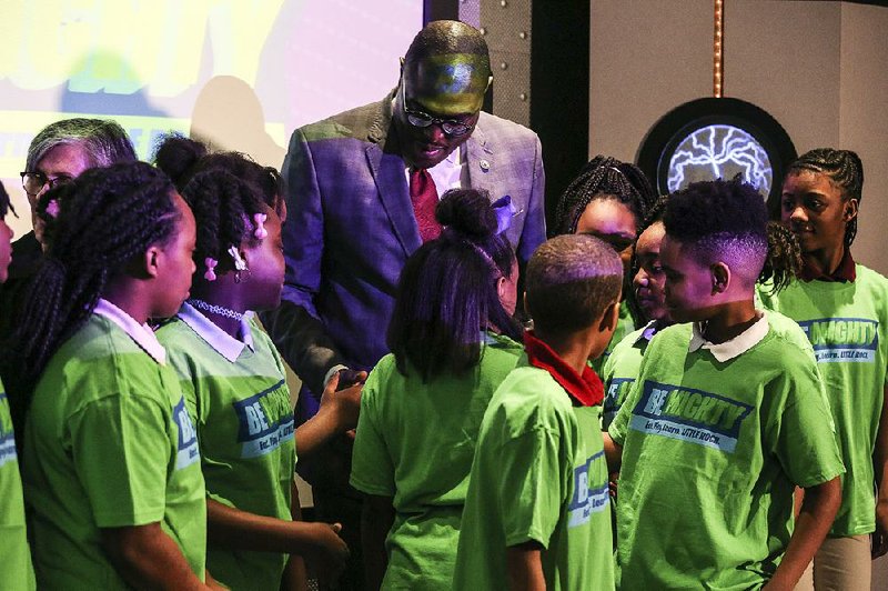 Little Rock Mayor Frank Scott Jr. greets children after a news conference for the “Be Mighty Little Rock” initiative at Stephens Elementary School in Little Rock on Wednesday. 
