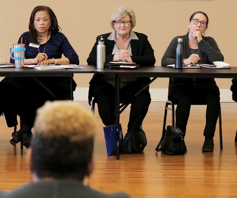 Little Rock City Director Capi Peck (right) talks Wednesday about an expansion of an effort to reduce homelessness in parts of the city during a meeting of the Arkansas Homeless Coalition. Others at the table are (from left) Sybil Ward, coordinator of community health at the Jefferson Comprehensive Care Systems Medical Center, and Homeless Coalition president Sandra Wilson. The meeting was held at the Willie L. Hinton Community Resource Center on West 12th Street in Little Rock. 