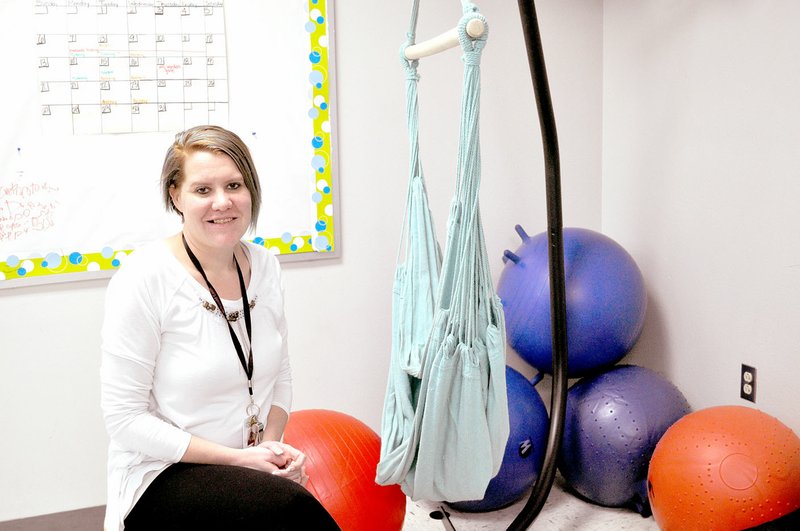 RACHEL DICKERSON/MCDONALD COUNTY PRESS Megan Worden, a teacher at White Rock Elementary and Junior High School, is pictured with an indoor hammock she purchased with a grant from the McDonald County Schools Foundation. Worden has alternative seating in her classroom.