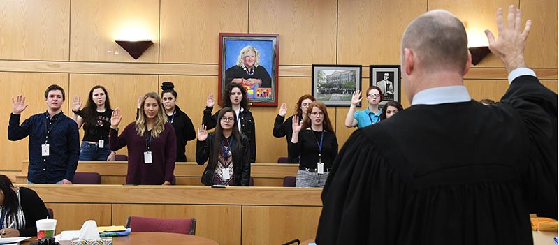 The Sentinel-Record/Grace Brown SWEARING IN: Division 2 Garland County Circuit Court Judge Wade Naramore swears in the jury at the mock trial of Teen Court at the Garland County Courts Building on Monday. Teen Court will try its first real case on Feb. 25.