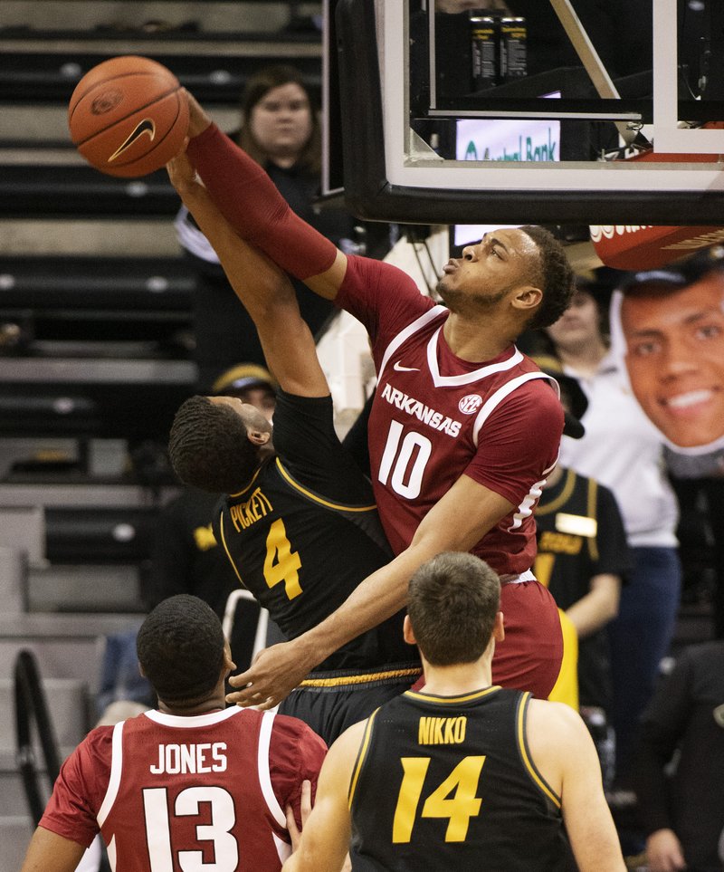 The Associated Press NOT TODAY: Arkansas's Daniel Gafford (10) blocks the shot of Missouri's Javon Pickett (4) during the first half of Tuesday's game in Columbia, Mo.