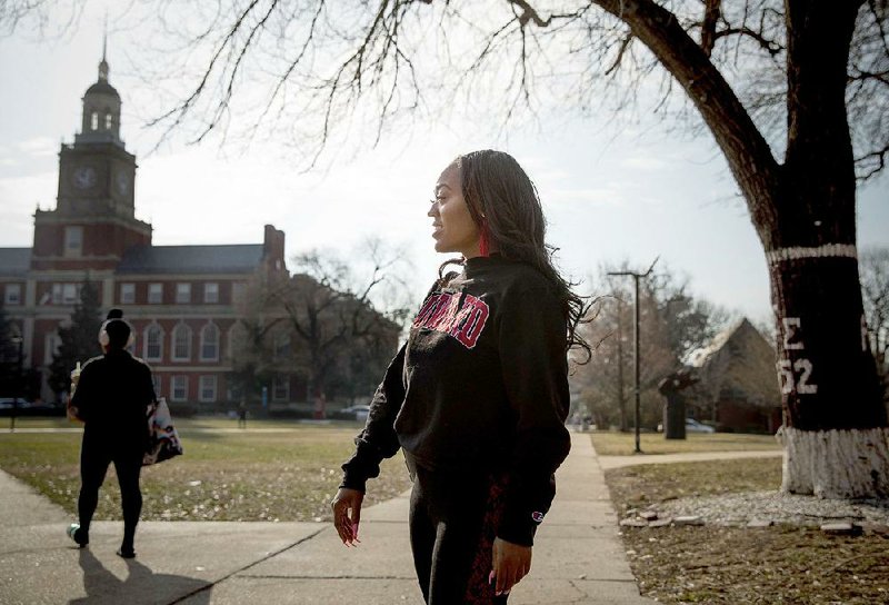 Mya Thompson, a 25-year-old senior at Howard University, walks  to class Feb. 6. Thompson  is a  recipient of a gift  from Alfred Street Baptist Church, which donated $100,000 to Howard University students to clear them of their student debt. 
