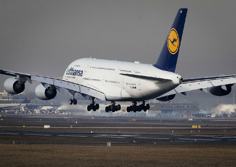 A Lufthansa airline Airbus A380 jumbo jet lands Thursday in Frankfurt, Germany. European plane manufacturer Airbus said Thursday that it will stop making the world’s biggest passenger jet. 