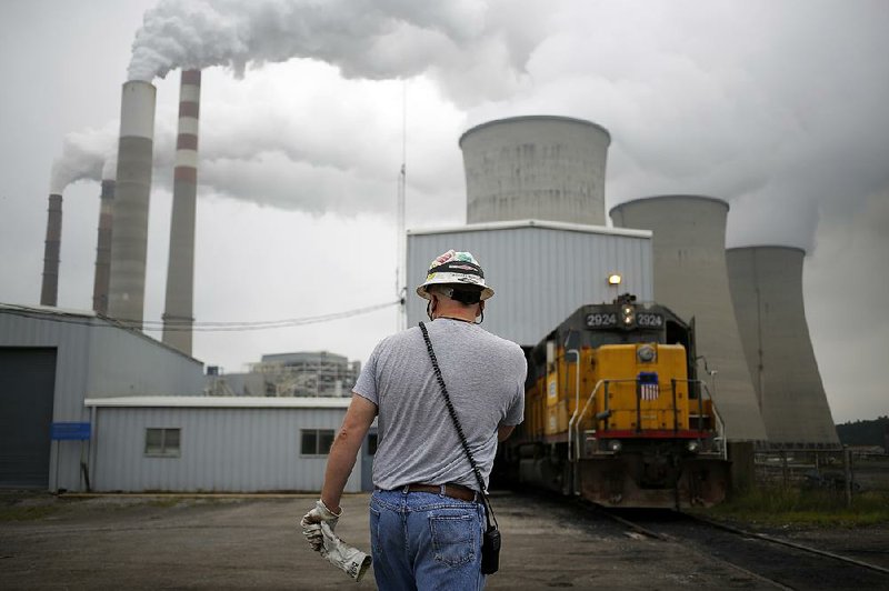 The Tennessee Valley Authority coal-fired power plant (above) in Paradise, Ky., is old and now scheduled to close. Its shutdown, one executive said, “is not about coal. This decision is about economics.” 