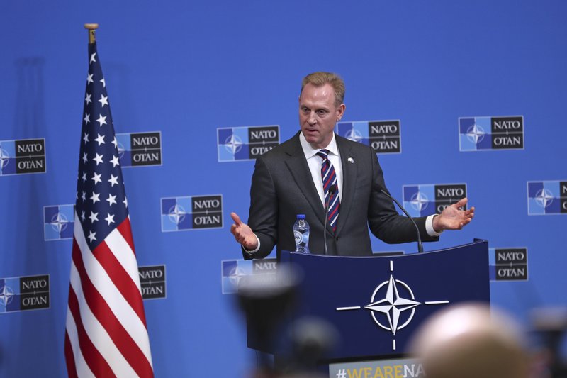Acting US Defence Secretary Patrick Shanahan talks to journalists during a press conference at the second day of a NATO defense ministers meeting at NATO headquarters in Brussels, Thursday, Feb. 14, 2019. NATO defense ministers are discussing the future of the alliance's operation in Afghanistan and how best to use its military presence to support political talks aimed at ending the conflict. (AP Photo/Francisco Seco)
