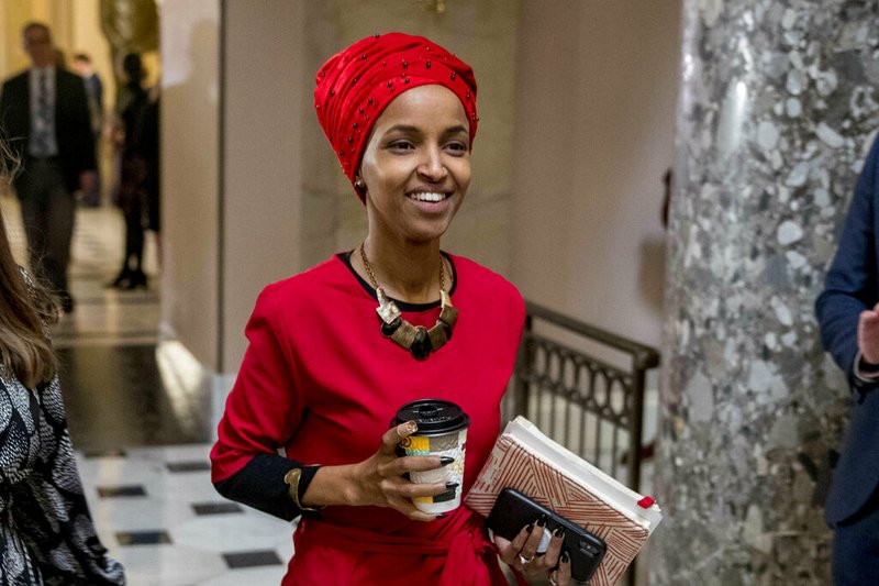 In this Jan. 16, 2019 file photo, Rep. Ilhan Omar, D-Minn., walks through the halls of the Capitol Building in Washington. 