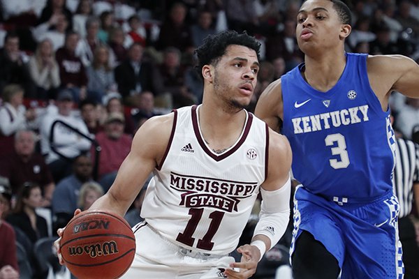 Mississippi State guard Quinndary Weatherspoon (11) tries to drive against the defense of Kentucky guard Keldon Johnson (3) in the first half of an NCAA basketball game against Mississippi State in Starkville, Miss., Saturday, Feb. 9, 2019. Kentucky won 71-67. (AP Photo/Rogelio V. Solis)

