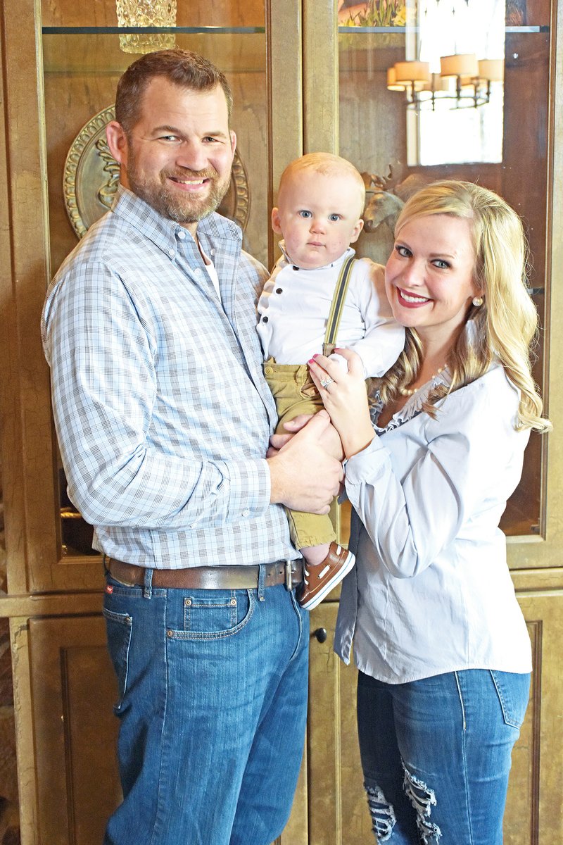 William Porterfield, left, and his wife, Ashley Porterfield, are life-group leaders for New Life Church of Saline County in Bryant. William, shown here holding their son, Mason, said the group fills a community need for couples in the area.