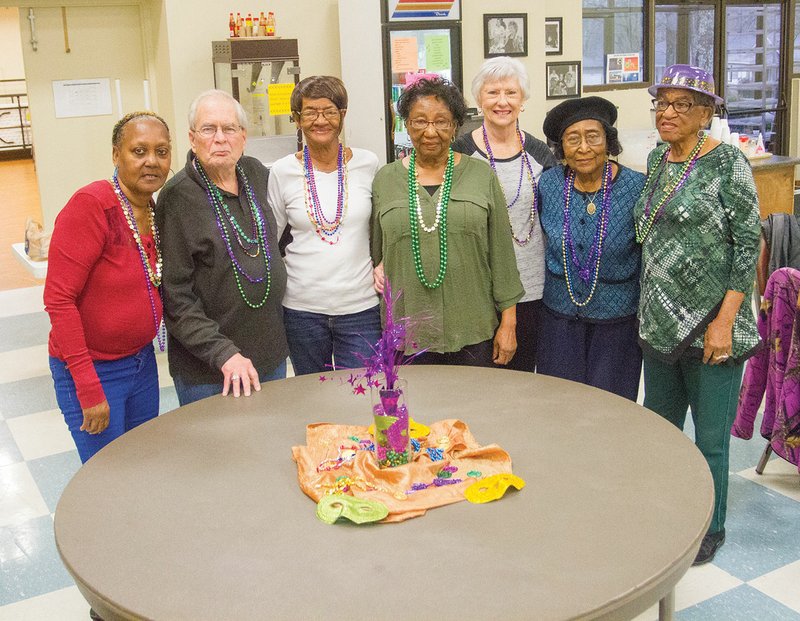 Patrons of the Jacksonville Senior Wellness and Activity Center wear beads and hats to show their support for the upcoming Taste of New Orleans fundraiser, set for Feb. 28 at the Jacksonville Community Center. Pictured are, from left, Ann Hammons, Sonny Meriedeth, Shirley Jackson, Ruthie Ford, Dorthy DeJesus, Gracie Kelley and Dorothy Rutledge.