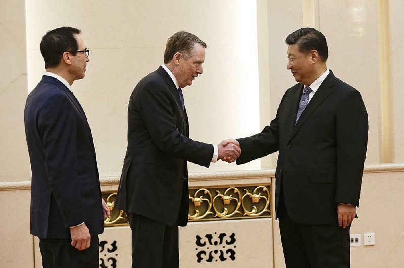 Top U.S. trade official Robert Lighthizer (center), along with Treasury Secretary Steven Mnuchin, greets Chinese President Xi Jinping before their meeting at the Great Hall of the People in Beijing. 
