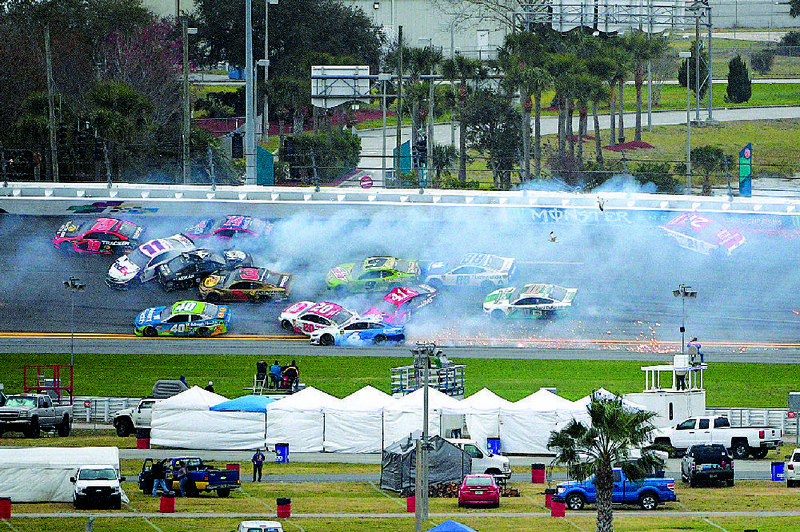 Drivers navigate a multi-car crash during NASCAR’s Daytona Clash race earlier this month at Daytona Beach International Speedway  in Florida. 