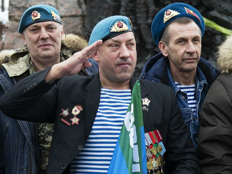 Veterans of the Soviet war in Afghanistan join a memorial ceremony Friday in Moscow. What the Kremlin in 1989 branded “a political mistake” is now being reframed as justified as Russian President Vladimir Putin pushes an image of a strong Russia with an unblemished past. 