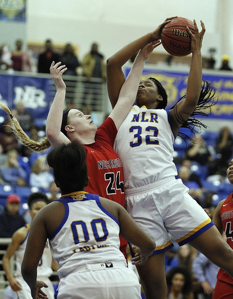 Amauri Williams (32) of North Little Rock scored 14 points and had nine rebounds in the Lady Charging Wildcats’ 70-64 overtime vic- tory over Fort Smith Northside on Friday night in North Little Rock.