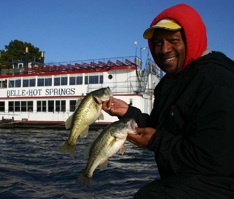 Largemouth bass begin their pre-spawn patterns in late winter, allowing anglers such as Tyrone Phillips of Little Rock to enjoy success at reservoirs such as Lake Hamilton. 