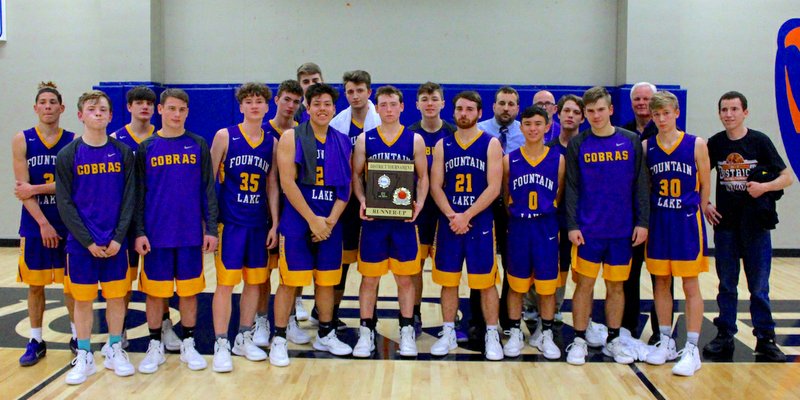 The Sentinel-Record/James Leigh DISTRICT RUNNER-UP: Fountain Lake's senior high boys' basketball team presented its runner-up trophy from the 3A-4 district tournament final following a 41-21 loss to Booneville on Thursday at Two Rivers in Ola.