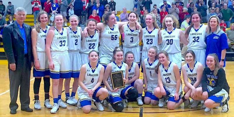 Submitted photo GIRLS' DISTRICT CHAMPS: Lakeside's junior high girls' basketball team celebrates after its 30-29 win against Magnolia on Thursday in the 5A-South district championship game at Hot Springs' Trojan Fieldhouse.