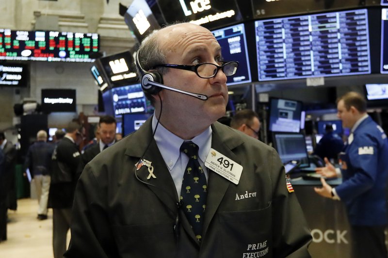 FILE- In this Feb. 5, 2019, file photo trader Andrew Silverman works on the floor of the New York Stock Exchange.  (AP Photo/Richard Drew, File)