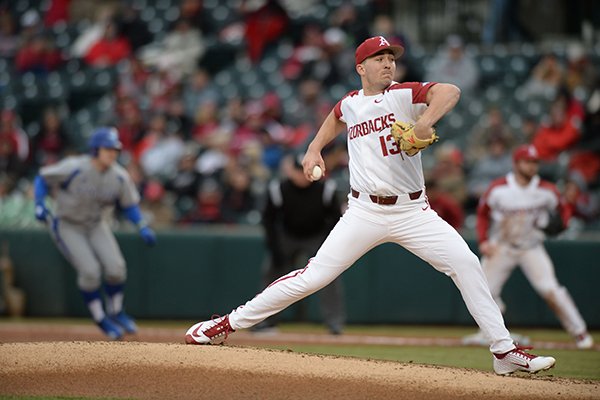 Arkansas starter Connor Noland delivers to the plate as Eastern Illinois first baseman Hunter Morris leads off of first Saturday, Feb. 16, 2019, during the first inning at Baum-Walker Stadium in Fayetteville.
