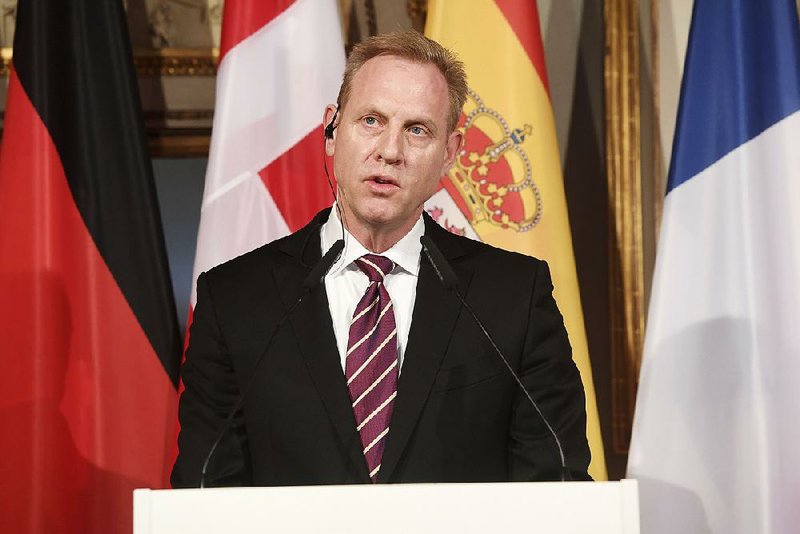 Acting Defense Secretary Patrick Shanahan, shown Friday in Munich, told reporters during the flight back to Washington that he has discretion in the redirection of money under President Donald Trump’s national emergency declaration. 