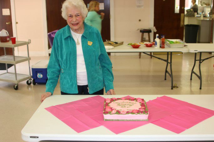 Courtesy photo The Garden Club of Rogers recognized longtime member Rosemary Bassham with a reception on Feb. 5. Bassham has been a member of the Rogers Garden Club for 25 years. The Arkansas Federation of Garden Clubs recognizes members with more than 25 years of membership with a Circle of Roses pin and a certificate recognizing their participation. She was presented with an arrangement of red roses from the club. Bassham has been a very active member, serving on many committees. She still attends meetings regularly.