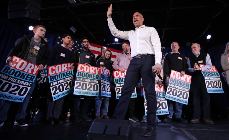 U.S. Sen. Cory Booker, D-N.J., waves to the crowd during a campaign stop in Portsmouth, N.H., Saturday, Feb. 16, 2019. (AP Photo/Charles Krupa)