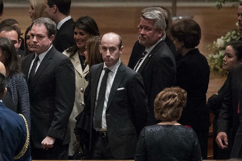 President Donald Trump's White House senior adviser Stephen Miller, center, and White House deputy chief of staff for communications Bill Shine, center right, arrives for a State Funeral for former President George H.W. Bush at the National Cathedral, Wednesday, Dec. 5, 2018, in Washington.