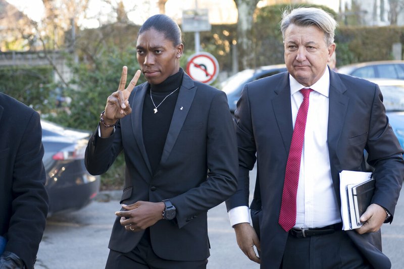 South Africa's runner Caster Semenya, left, current 800-meter Olympic gold medalist and world champion, and her lawyer Gregory Nott, right, arrive for the first day of a hearing at the international Court of Arbitration for Sport, CAS, in Lausanne, Switzerland, Monday, Feb. 18, 2019. Semenya has filed an appeal in the CAS against the International Association of Athletics Federations (IAAF) ruling, forcing female runners to medicate to reduce their testosterone levels for six months before racing internationally. (Laurent Gillieron/Keystone via AP)