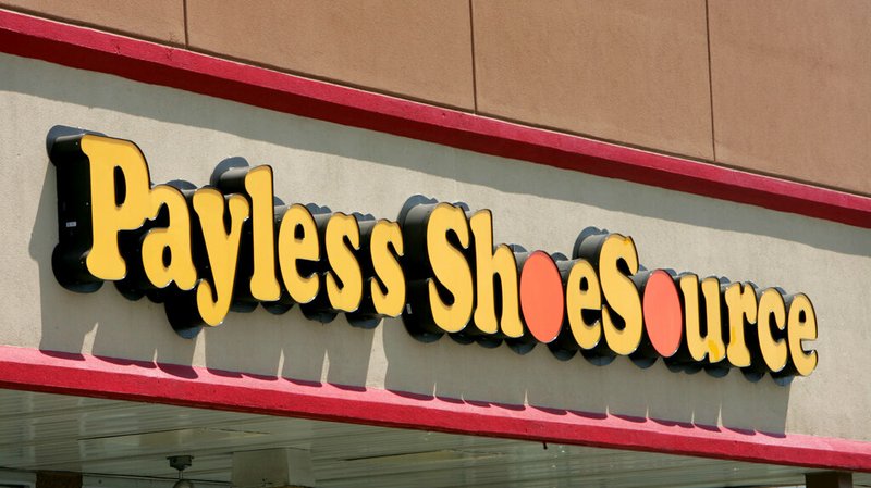 This Aug. 23, 2006, file photo shows a Payless store front is seen in Philadelphia. Paylesss ShoeSource is shuttering all of its 2,100 remaining stores in the U.S. and Puerto Rico, joining a list of iconic names like Toys R Us and Bon-Ton that have been shuttered in the last year. The Topeka, Kansas-based chain said Friday, Feb. 15, 2019 it will hold liquidation sales starting Sunday and wind down its e-commerce operations. (AP Photo/Matt Rourke, File)