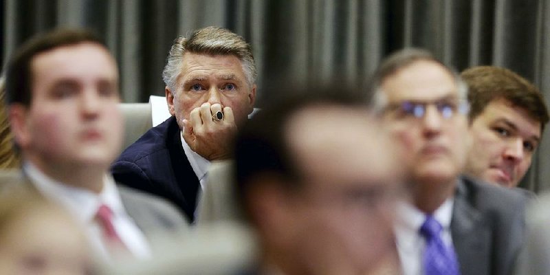 Mark Harris, a North Carolina Republican whose victory in a U.S. House race has not been certified because of a ballot scandal, listens Monday during a hearing in Raleigh. 