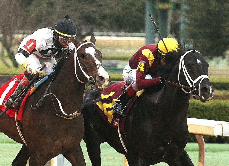 Jockey John Velazquez and Coal Front (right) beat Copper Bullet (1) to win the Razorback Handicap at Oaklawn Park on Monday. Coal Front’s winning time was 1:43.45 in the 1 1/16-mile race.