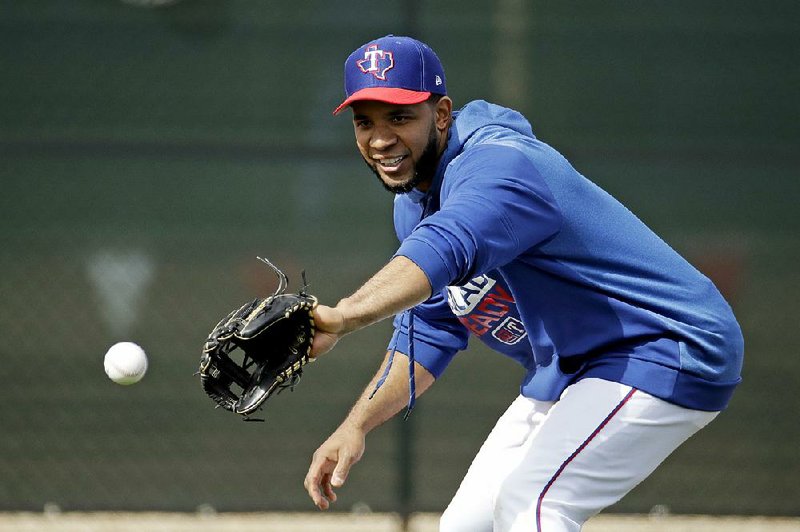 Texas Rangers shortstop Elvis Andrus fields a ball during practice Monday in Surprise, Ariz. Andrus will assume a bigger leadership role now that third baseman Adrian Beltre is retired.