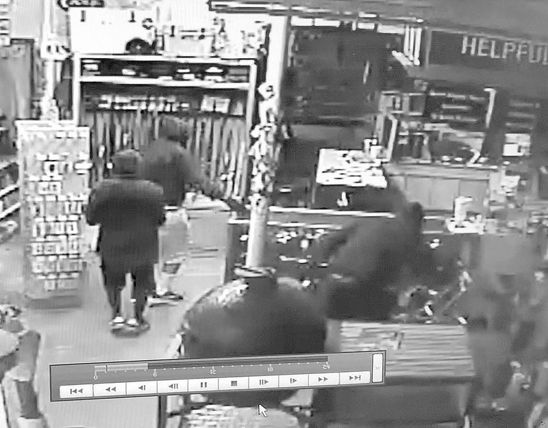 Courtesy Photo/PRAIRIE GROVE POLICE The three burglars are show in this photo from surveillance video at Prairie Grove Ace Hardware Store early Friday monring. The suspects broker into the store twice and stole weapons.