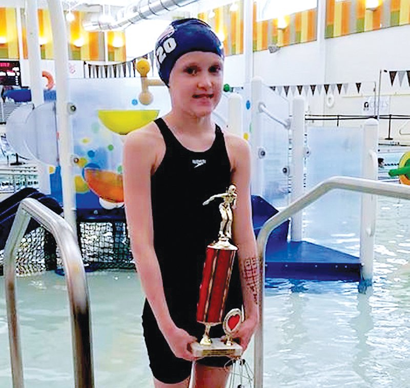 Submitted photo HIGH POINT: Hot Springs Family YMCA Seals swim team member Aubrey Schmitt was recently recognized at the Donaghey Student Center at UALR after winning the most points in her division at the Valentine Invitational meet.