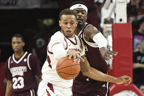 Mississippi State defender Aric Holman (35) puts the pressure on Arkansas forward Daniel Gafford (10) during the second half of an NCAA college basketball game, Saturday, Feb. 16, 2019 in Fayetteville. (AP Photo/Michael Woods)

