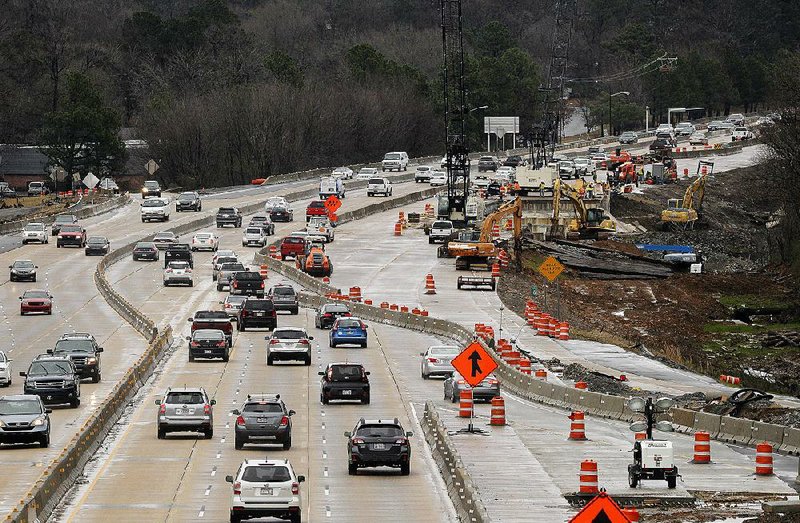 FILE — Traffic flows along Interstate 630 in Little Rock as construction crews work on a widening project in this Jan. 4, file photo. 