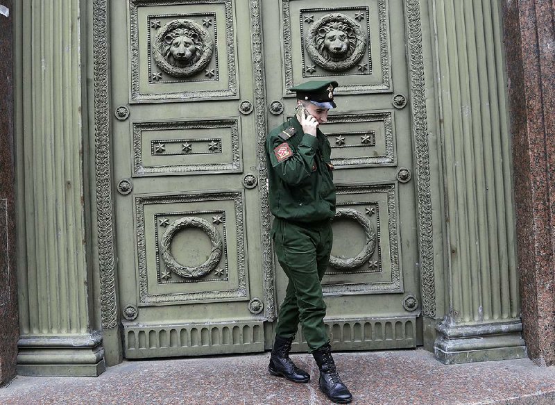 A Russian soldier talks on his smartphone in early July during the 2018 World Cup soccer tournament in St. Petersburg.