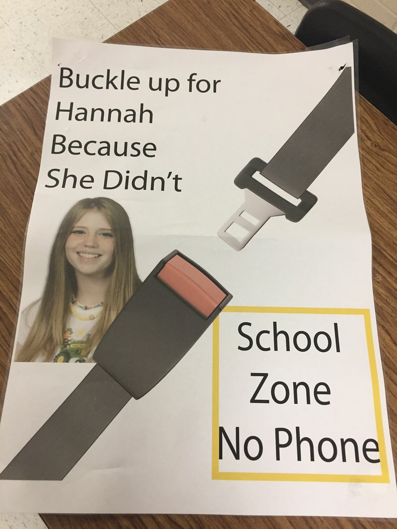 COURTESY PHOTO Peggy Hackett, a crossing guard for Prairie Grove Middle School, uses this flyer to remind parents and students about the importance of wearing a seatbelt and not using a handheld cell phone in a school zone.