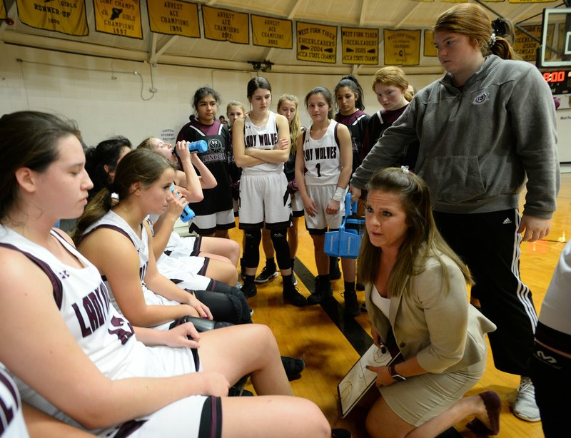 NWA Democrat-Gazette/ANDY SHUPE Lincoln coach Emilianne Slamons talks with her players during the 3A-1 West Conference Tournament at West Fork. Lincoln will take a 23-6 record into the 3A Region I Tournament at Mountain View, where the Lady Wolves open against Bergman at 4 p.m. on Thursday.
