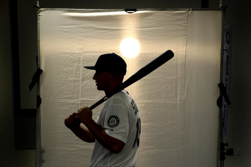 Seattle Mariners' Kyle Seager poses for a photographer during the team's photo day at spring training baseball practice Monday, Feb. 18, 2019, in Peoria, Ariz. (AP Photo/Charlie Riedel)