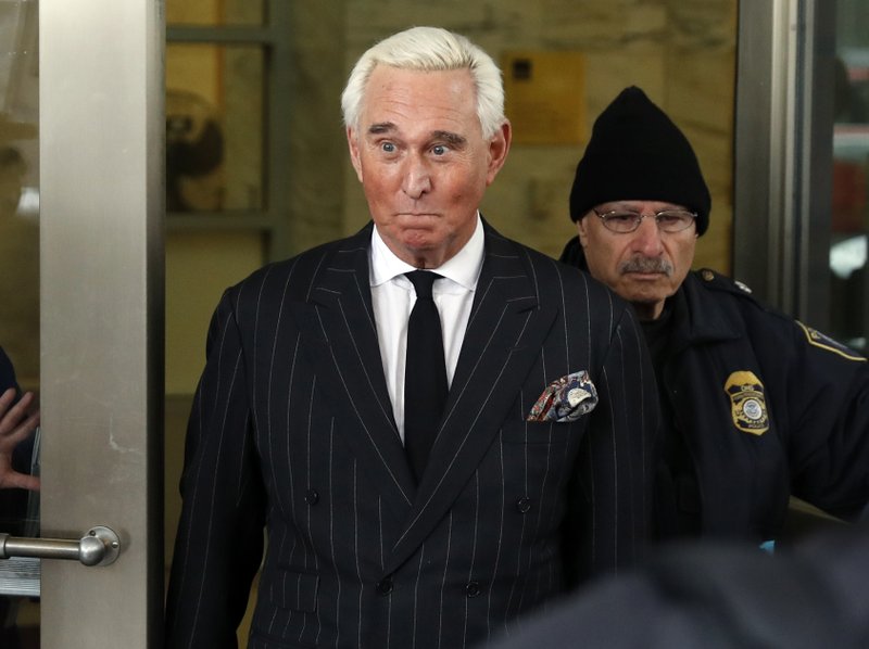 In this Feb. 1, 2019, file photo, former campaign adviser for President Donald Trump, Roger Stone, leaves federal court in Washington. (AP Photo/Pablo Martinez Monsivais, File)