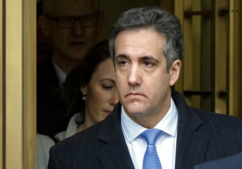 In this Dec. 12, 2018 file photo, Michael Cohen, President Donald Trump's former lawyer, leaves federal court after his sentencing in New York. A judge has agreed to postpone the start of Cohen's prison sentence by two months to May 6. New York Judge William Pauley signed off on the delay Wednesday, Feb. 20, 2019, after Cohen's lawyer said he needed more time to recover from shoulder surgery. They noted prosecutors did not object to the one-time extension. (AP Photo/Craig Ruttle, File)