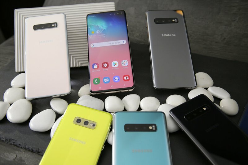 In this Tuesday, Feb. 19, 2019, photo is a selection of the new Samsung Galaxy S10 smartphones during a product preview in San Francisco. (AP Photo/Eric Risberg)