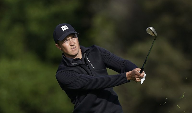 Jordan Spieth watches his chip onto the 13th green during the first round of the Genesis Open golf tournament at Riviera Country Club Thursday, Feb. 14, 2019, in the Pacific Palisades area of Los Angeles. 