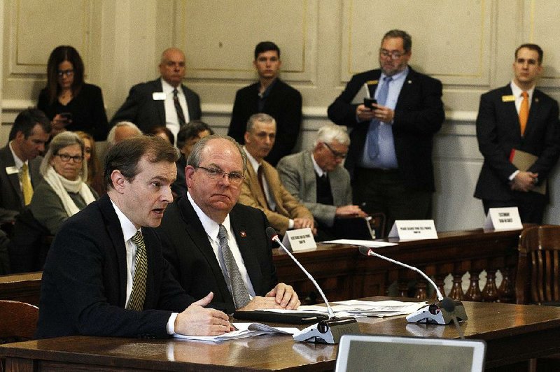 Paul Gehring (left) of the state Department of Finance and Administration discusses the highway funding bill Wednesday in the Senate Revenue and Taxation Committee. Sitting with Gehring is Sen. Terry Rice, sponsor of the bill. 