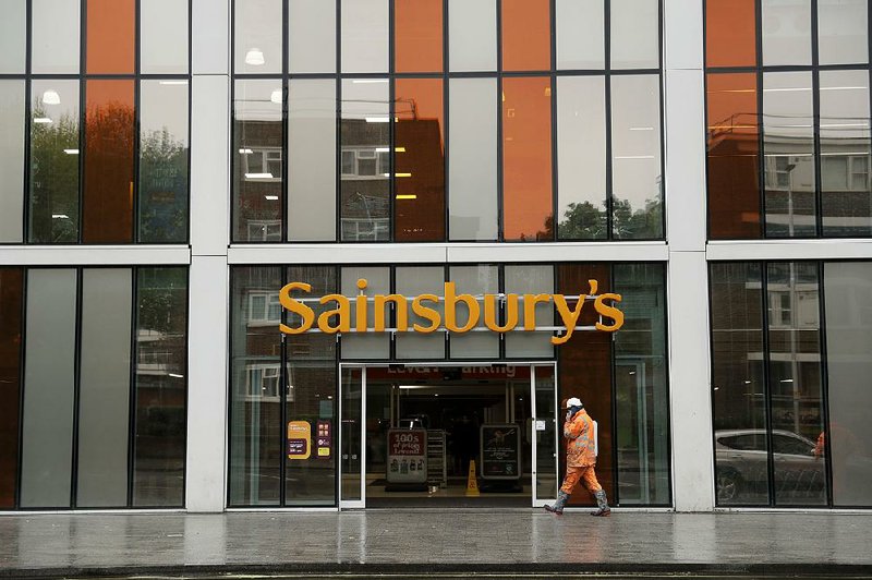 Sainsbury’s is the flagship store in London’s Nine Elms area. British regulators Wednesday said the proposed supermarket merger between Sainsbury’s and Walmart’s Asda unit would raise prices and lower quality. 