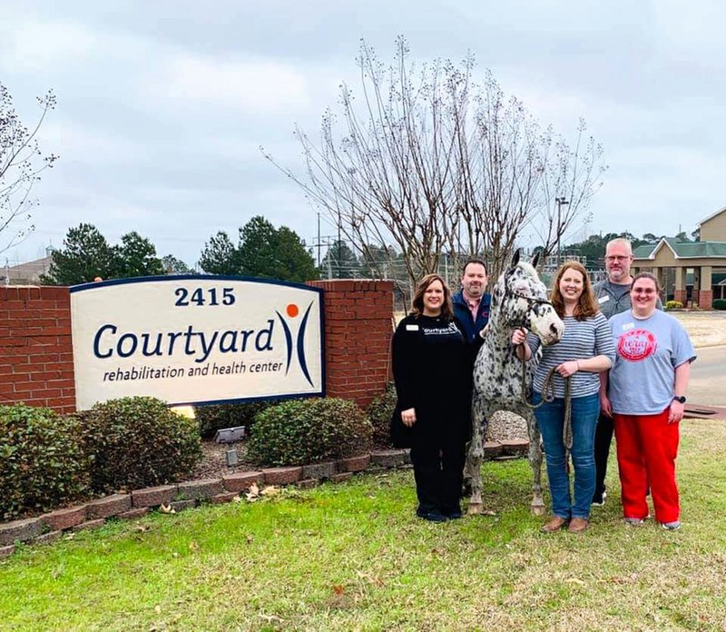 From left to right: Ashley Mathews, speech-language pathologist; Billy Holmes, regional director of Procare Therapy Services; Teka; Anna Redford, owner of Teka; Kevin Arrington, physical therapy assistant; and Caitlyn Robison, occupational therapy assistant. Contributed photo