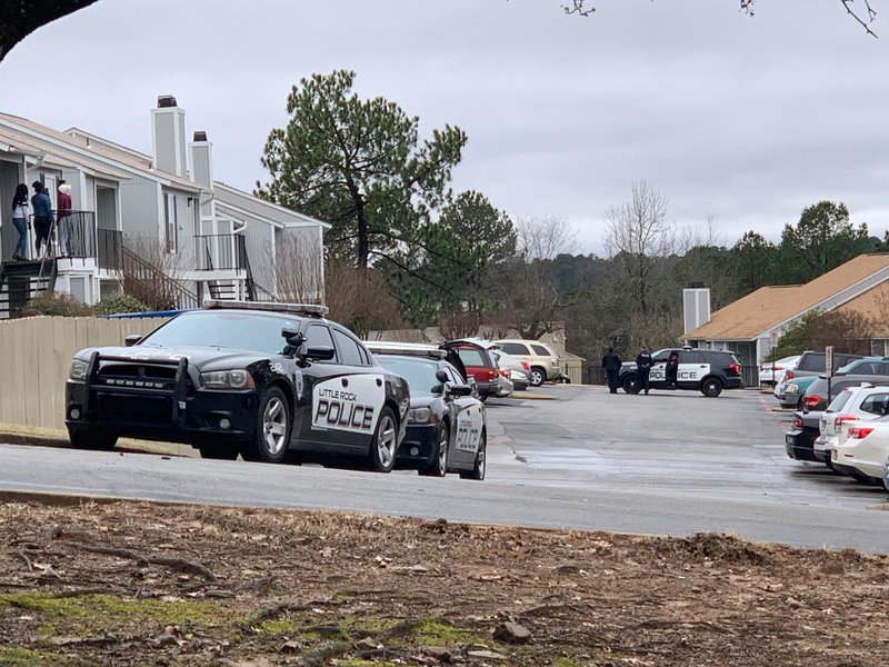 Police investigate at an apartment complex in the 11700 block of Mara Lynn Road on Wednesday.