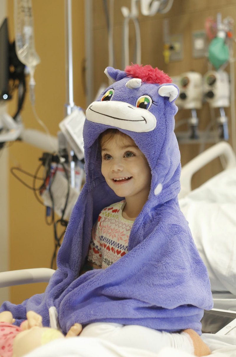 FILE PHOTO/DAVID GOTTSCHALK Mila Rosa Tatibouet, 3, looks toward her mom in her room on the fourth floor of Arkansas Children's Northwest in Springdale. The inaugural a la Carte on March 7 will help support the work of the hospital's Northwest Arkansas Circle of Friends.