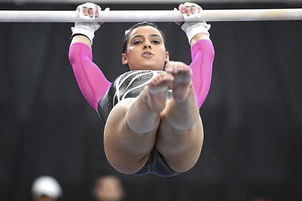 Arkansas gymnast Sophia Carter competes on the bars against Alabama during an NCAA Gymnastics meet, Feb. 8, 2019 in Fayetteville. (AP Photo/Michael Woods)