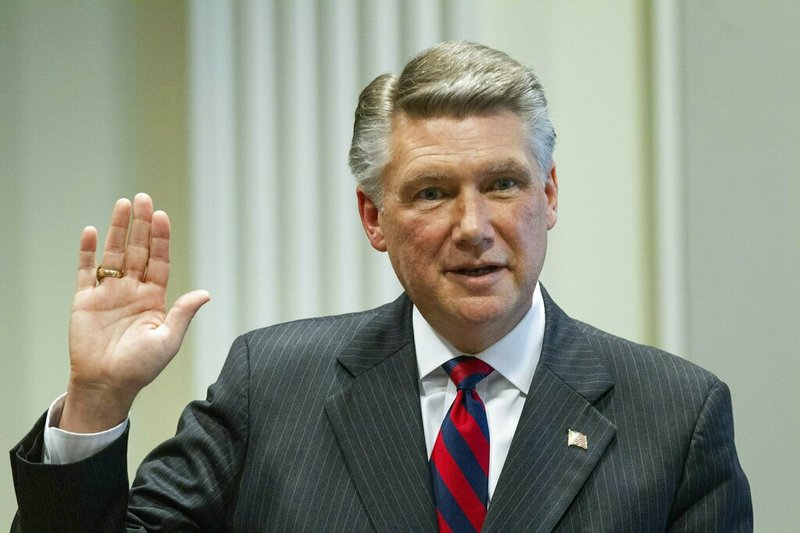Mark Harris, Republican candidate in North Carolina's 9th Congressional race, prepares to testify during the fourth day of a public evidentiary hearing on the 9th Congressional District voting irregularities investigation Thursday, Feb. 21, 2019, at the North Carolina State Bar in Raleigh, N.C. (Travis Long/The News & Observer via AP, Pool)